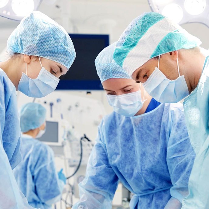 group-of-surgeons-in-operating-room-at-hospital-PLUMT42.jpg